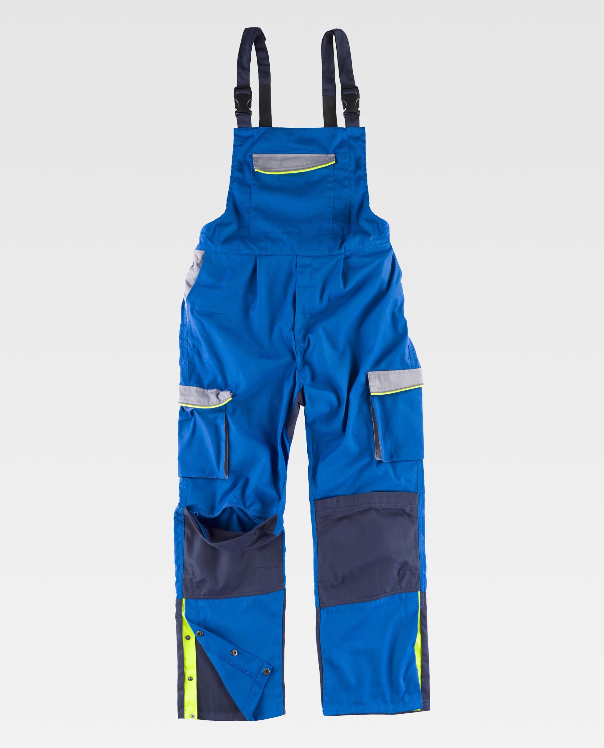 peto de trabajo azul con tirantes ajustables, bolsillos múltiples y detalles reflectantes amarillo y gris