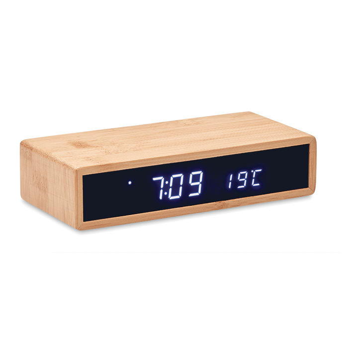 reloj despertador digital de madera con pantalla que indica las 7:09 y 19 °C
