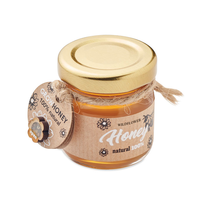 Frasco de miel de flores silvestres natural 100% con etiqueta de papel y tapa dorada