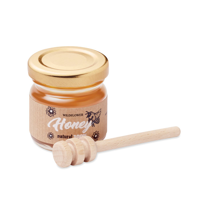 Tarro de miel de flores silvestres con cucharilla de madera