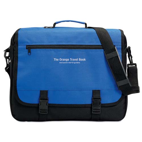 Bolsa de mensajero azul y negra con asa superior, correa ajustable y texto The Orange Travel Book en el frente.