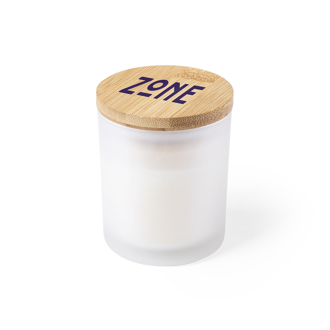 vela aromática en vaso de cristal esmerilado con tapa de bambú grabada con el texto ZONE