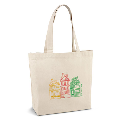 bolsa de tela beige con ilustración de tres casas estilizadas en amarillo, rojo y verde