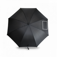 Paraguas negro abierto con un recuadro punteado que indica el área de estampado