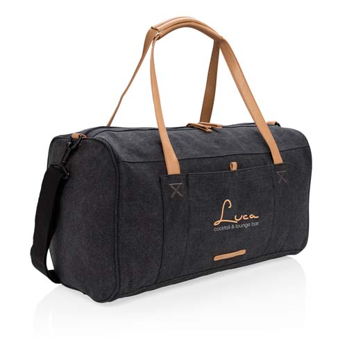 Bolsa de viaje de lona negra con asas de piel en tono camel y logotipo Luca cocktail & lounge bar